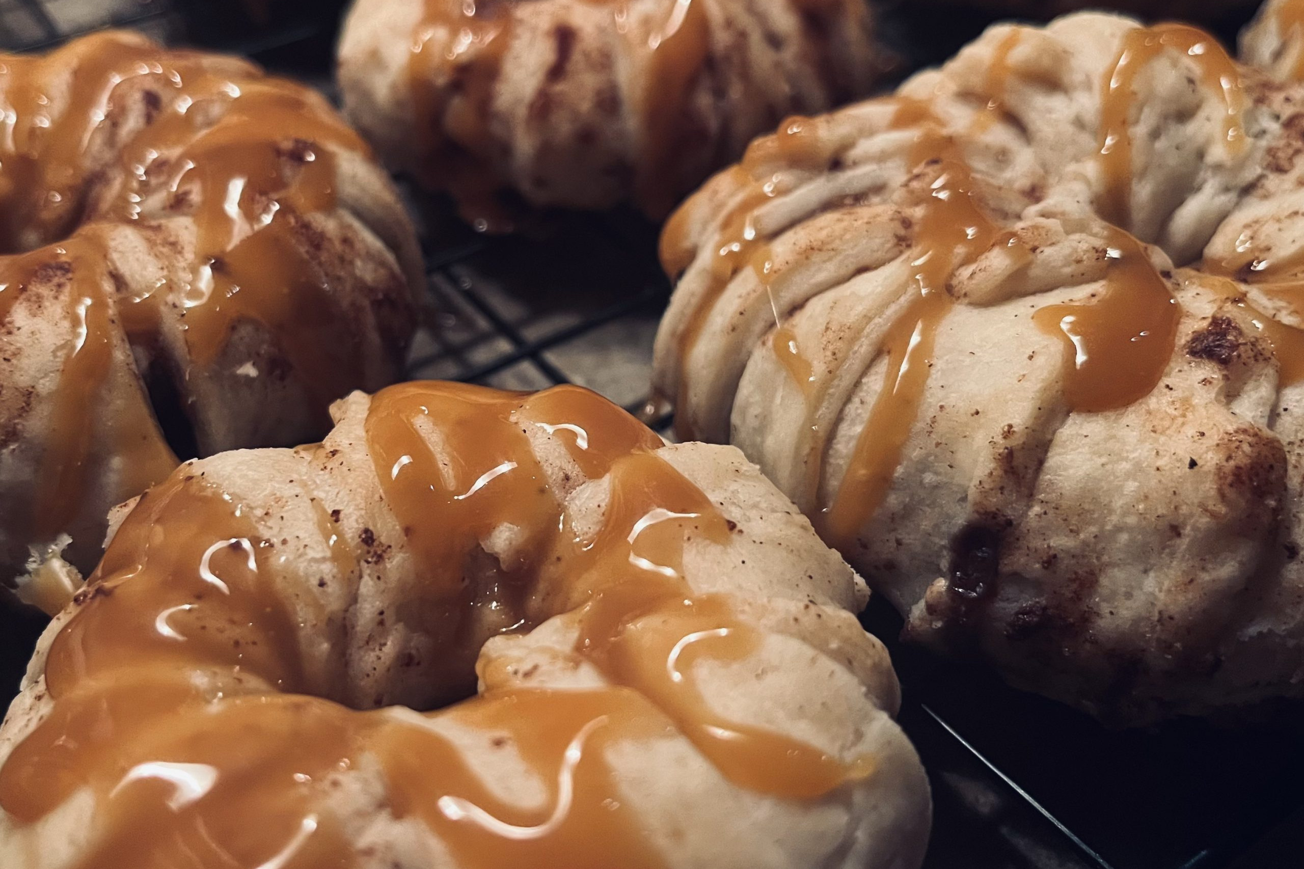 apple pie ring pasteries drizzled with caramel