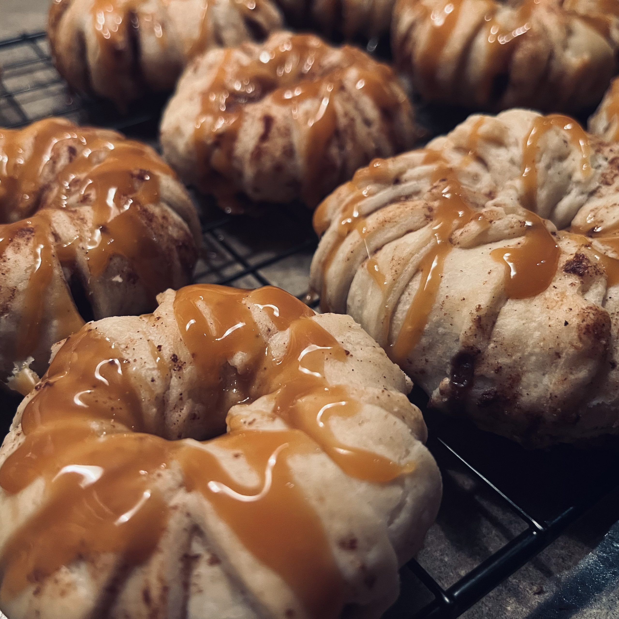 apple pie ring pasteries drizzled with caramel