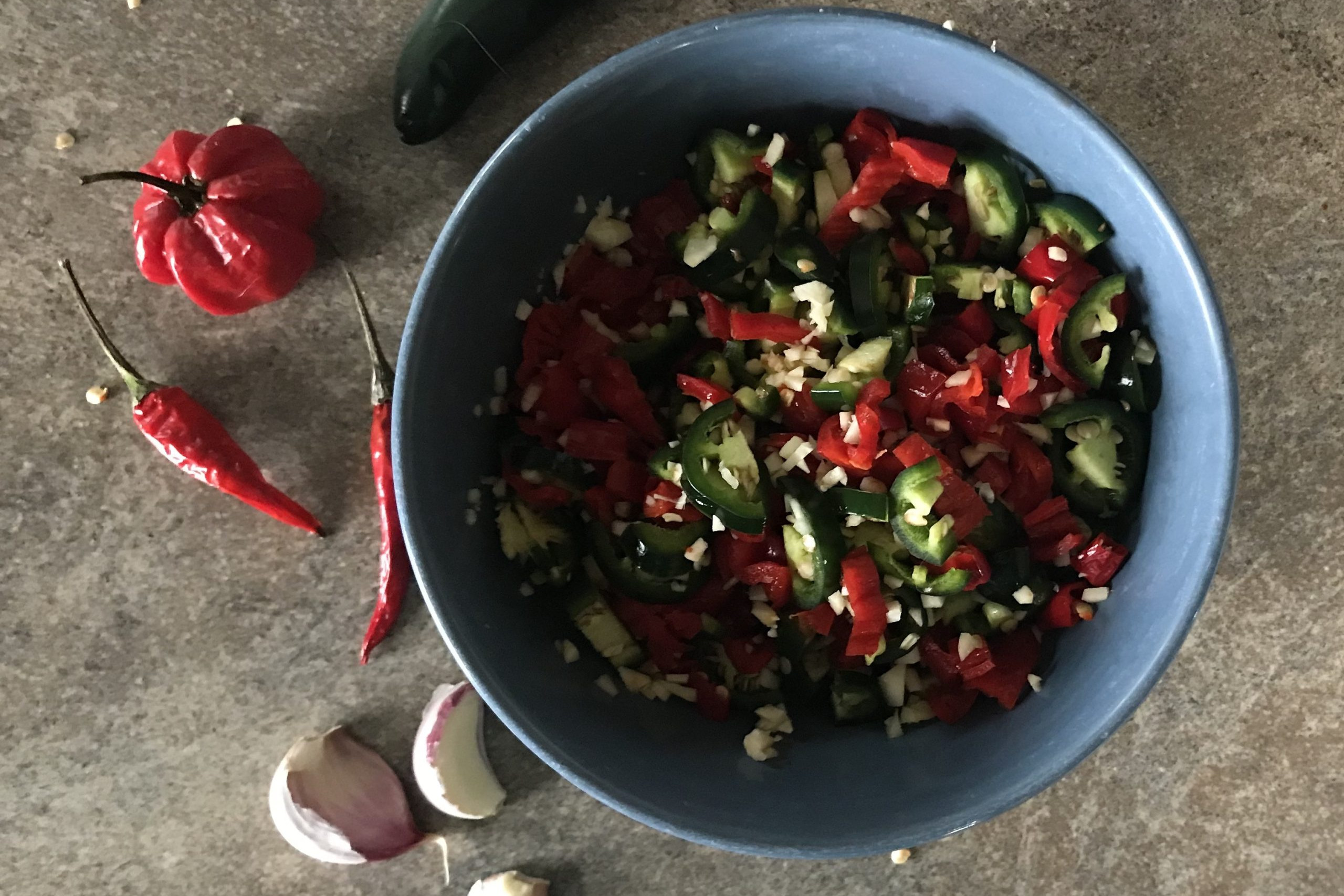 peppers and garlic on kitchen counter